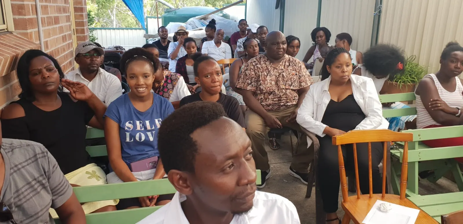UKACA members gathered together at a community meeting