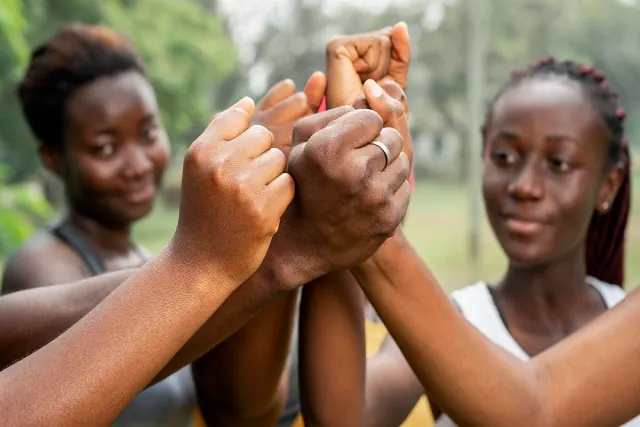Hands stacked together as a team